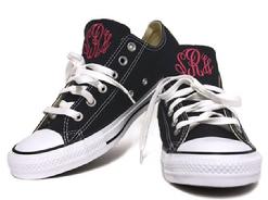 Monogrammed converse sneakers.