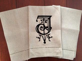 Monogrammed hem stitched tea towel. 
